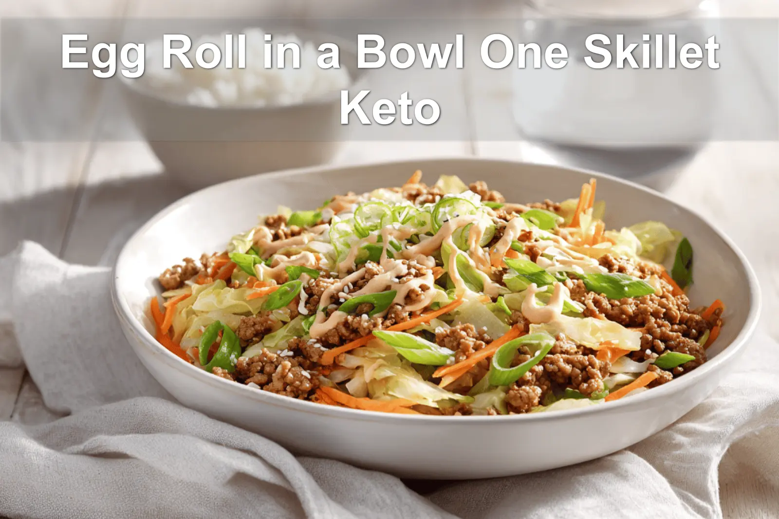 Egg Roll in a Bowl One Skillet Keto aromatic turkey cabbage bowl with sriracha mayo drizzle and sesame