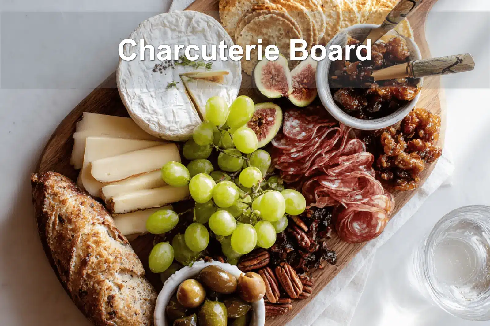 Charcuterie Board Secrets: Easy, Delicious Ideas 3 Charcuterie Board with brie prosciutto grapes figs crackers on warm styled table