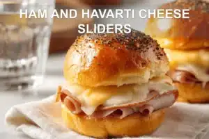 HAM AND HAVARTI CHEESE SLIDERS melted Havarti on Hawaiian rolls with poppy seeds
