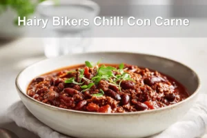 Hairy Bikers Chilli Con Carne hearty bowl on white napkin with glass of water