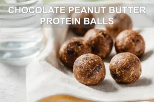 CHOCOLATE PEANUT BUTTER PROTEIN BALLS on white napkin with glass of water warm natural light