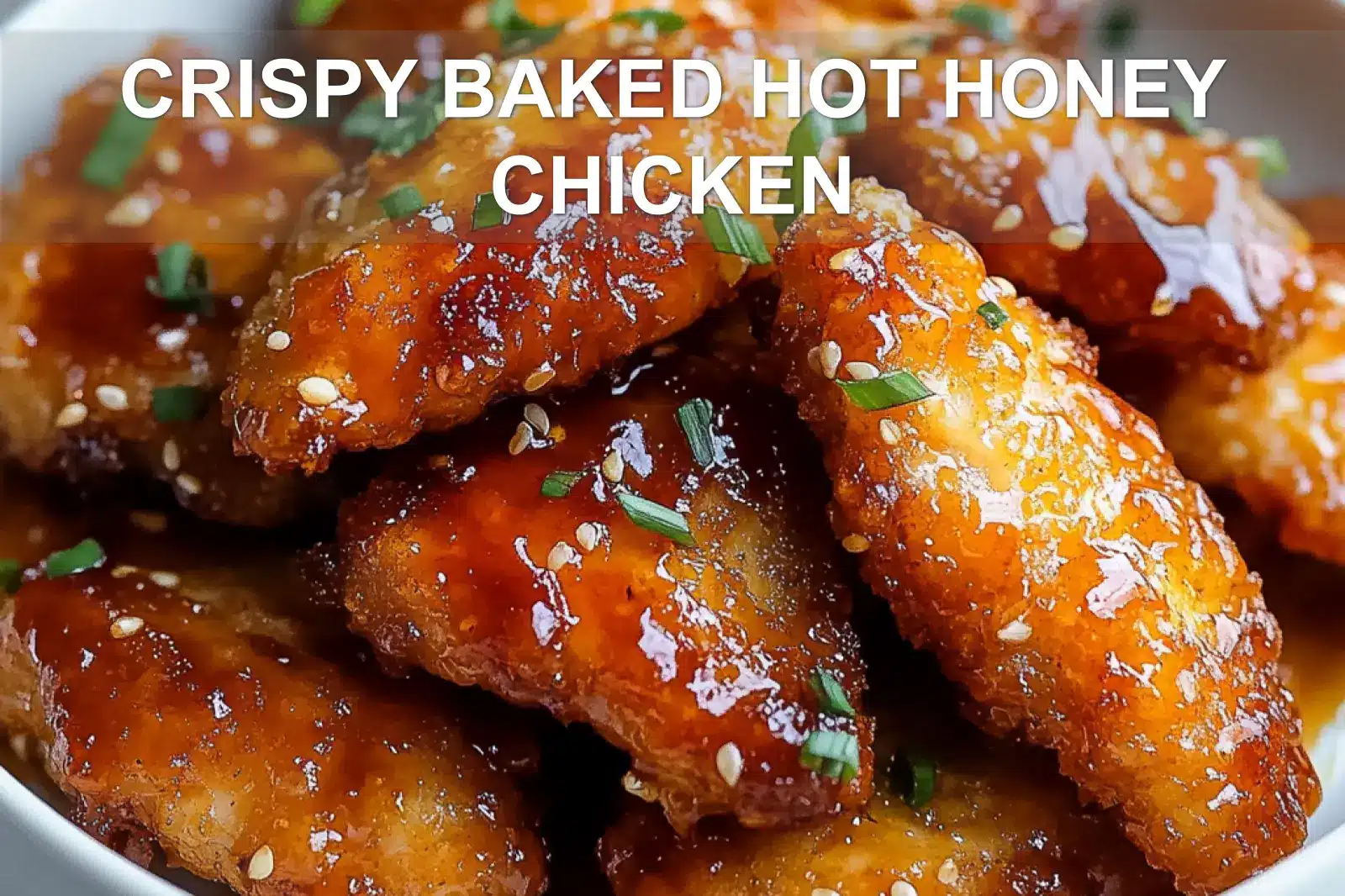 Crispy baked hot honey chicken glazed with a vibrant sauce and sesame seeds