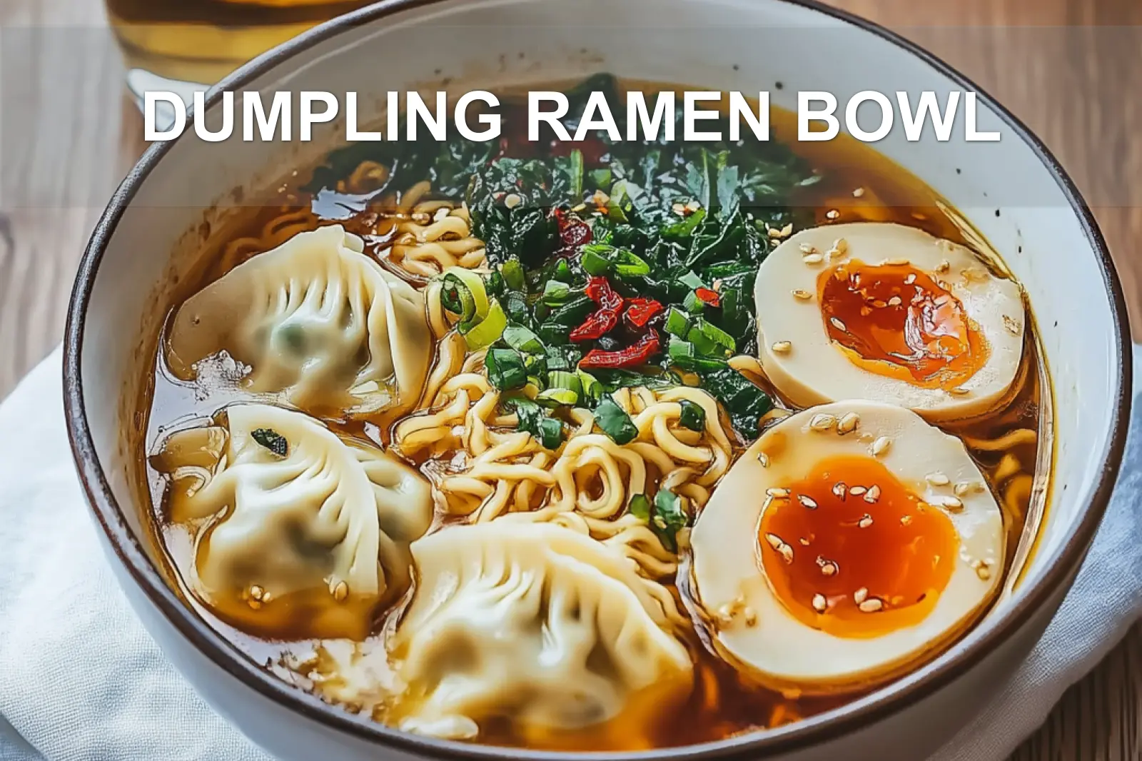 DUMPLING RAMEN BOWL with dumplings ramen eggs spinach green onions black sesame seeds