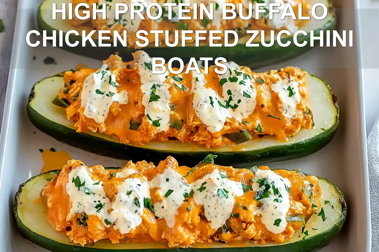 High protein buffalo chicken stuffed zucchini boats with a vibrant topping