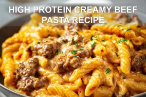 HIGH PROTEIN CREAMY BEEF PASTA RECIPE plated penne with ground beef creamy yogurt sauce fresh herbs