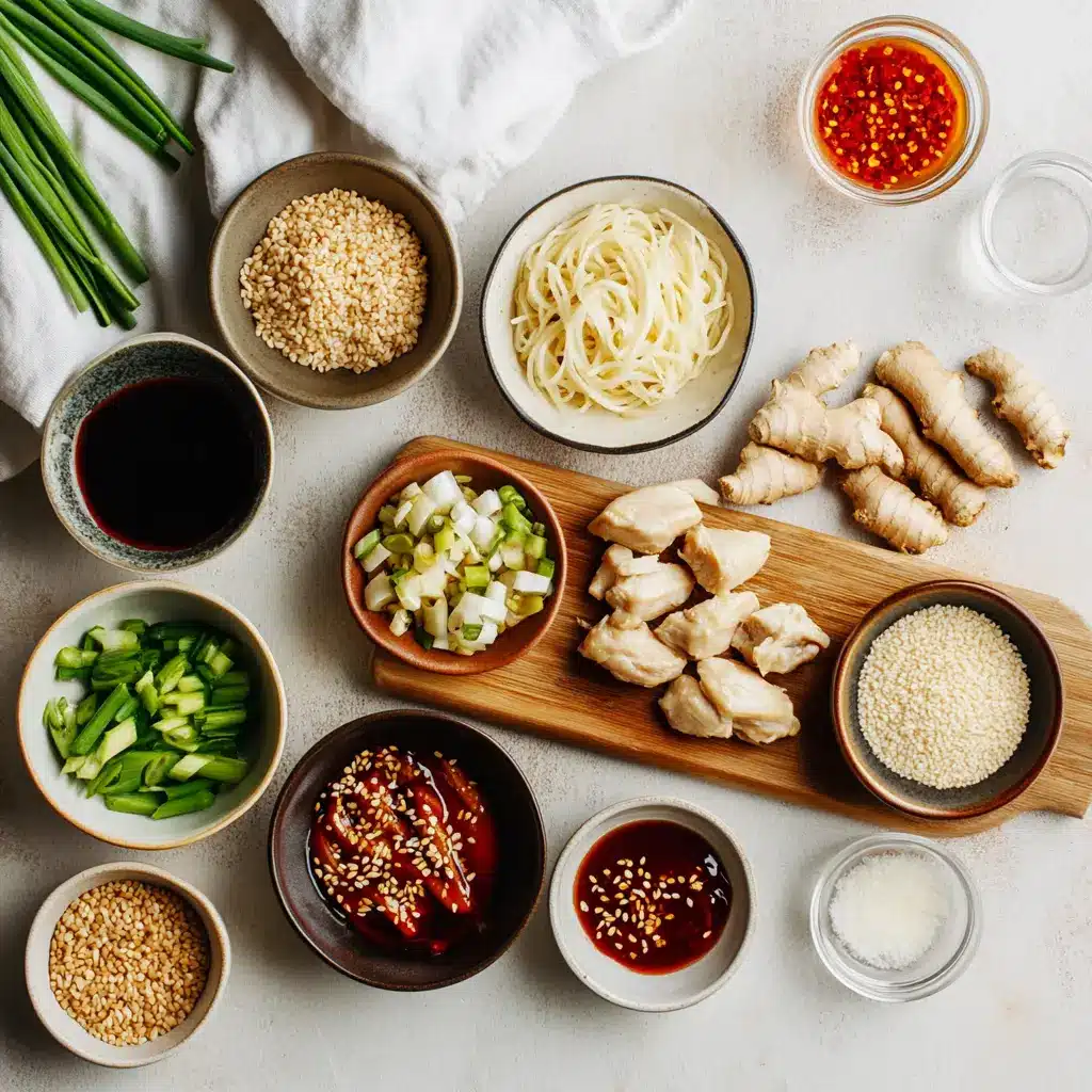STICKY GARLIC CHICKEN NOODLES glazed chicken and noodles in warm bowl with green onions