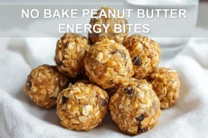 NO BAKE PEANUT BUTTER ENERGY BITES on white napkin with clear glass of water warm tones