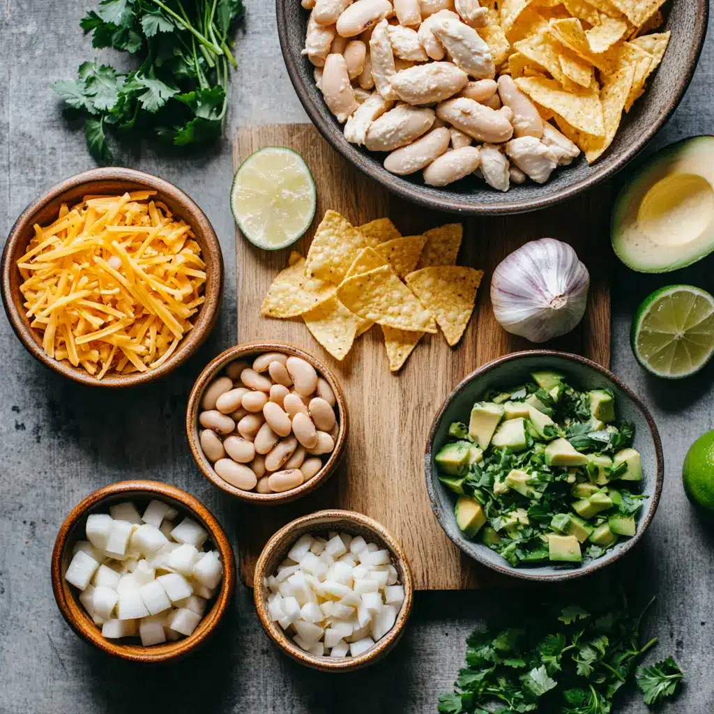 A bowl of creamy White Bean Chicken Chili, garnished with fresh cilantro and a lime wedge, in a clean, inviting setting.