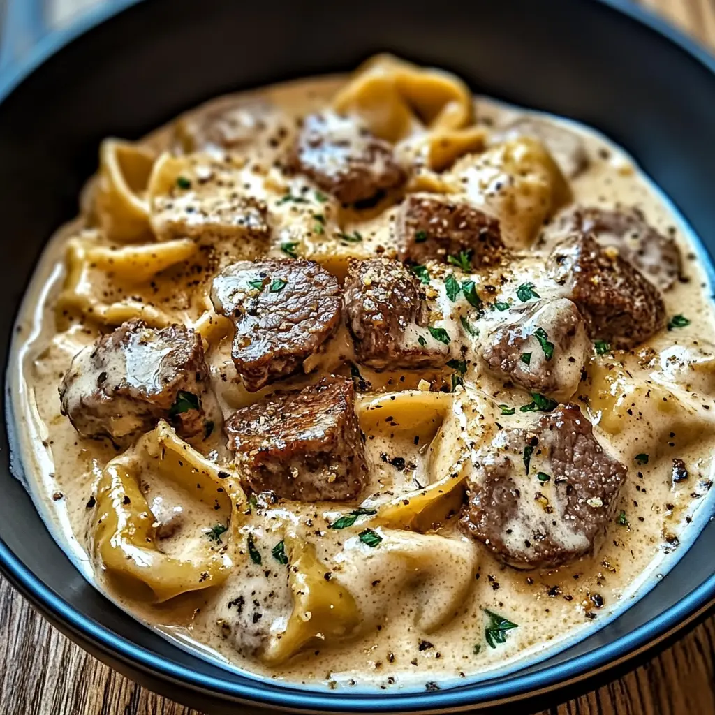 Easy Cracked Garlic Steak Tortellini in Creamhouse Sauce 2 CRACKED GARLIC STEAK TORTELLINI IN CREAMHOUSE SAUCE BLISS centered hero view, clean and uncluttered