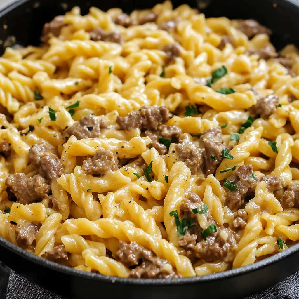 ONE POT CREAMY BEEF AND GARLIC BUTTER PASTA centered hero view, clean and uncluttered