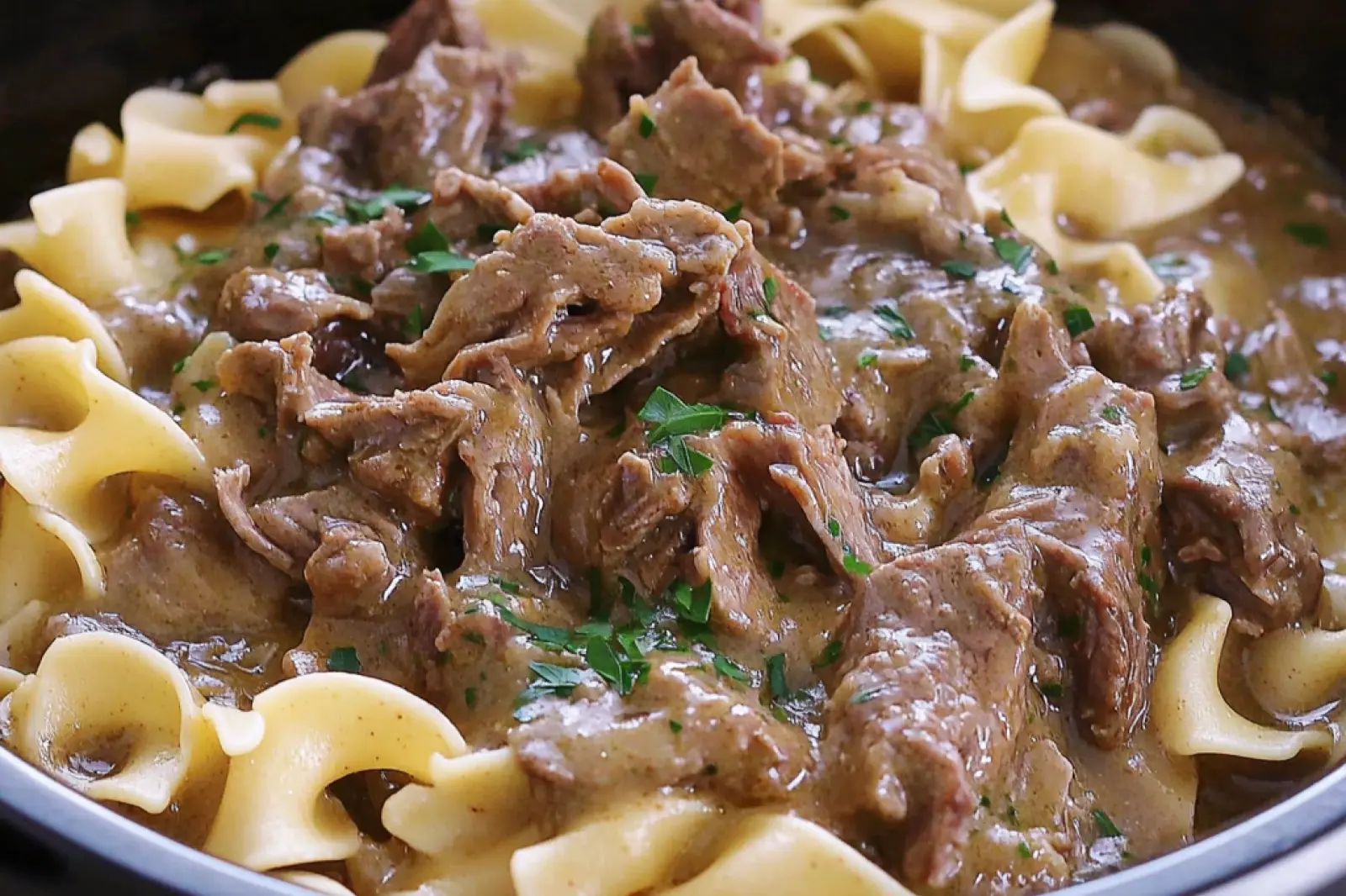 CROCK POT BEEF AND NOODLES centered hero view, clean and uncluttered