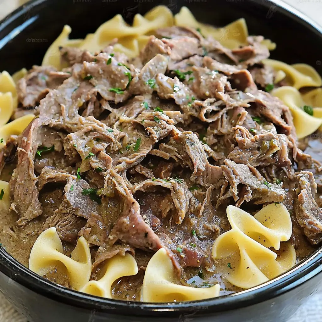Crock Pot Beef and Noodles Easy Comforting Weeknight Dinner 2 CROCK POT BEEF AND NOODLES centered hero view, clean and uncluttered